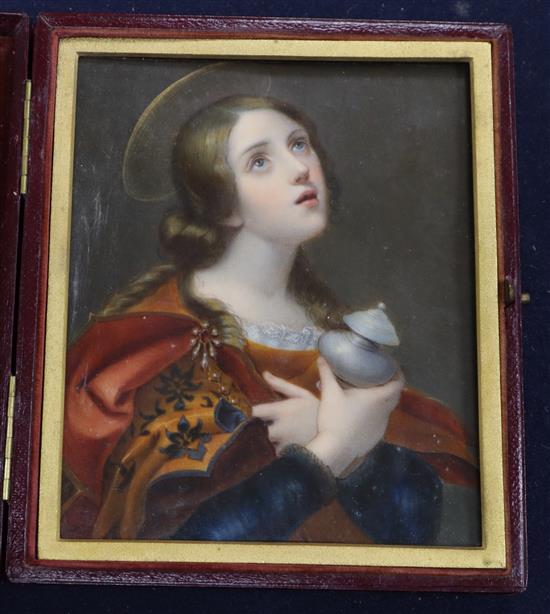 A 19th century oil on ivory miniature of a female saint, 13 x 11cm, leather cased